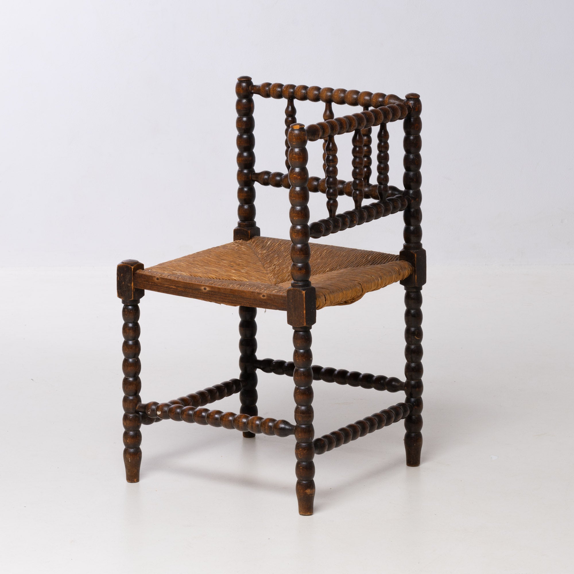 BRUTALIST OAK AND WICKER CORNER CHAIR, 1970S, DUTCH DESIGN