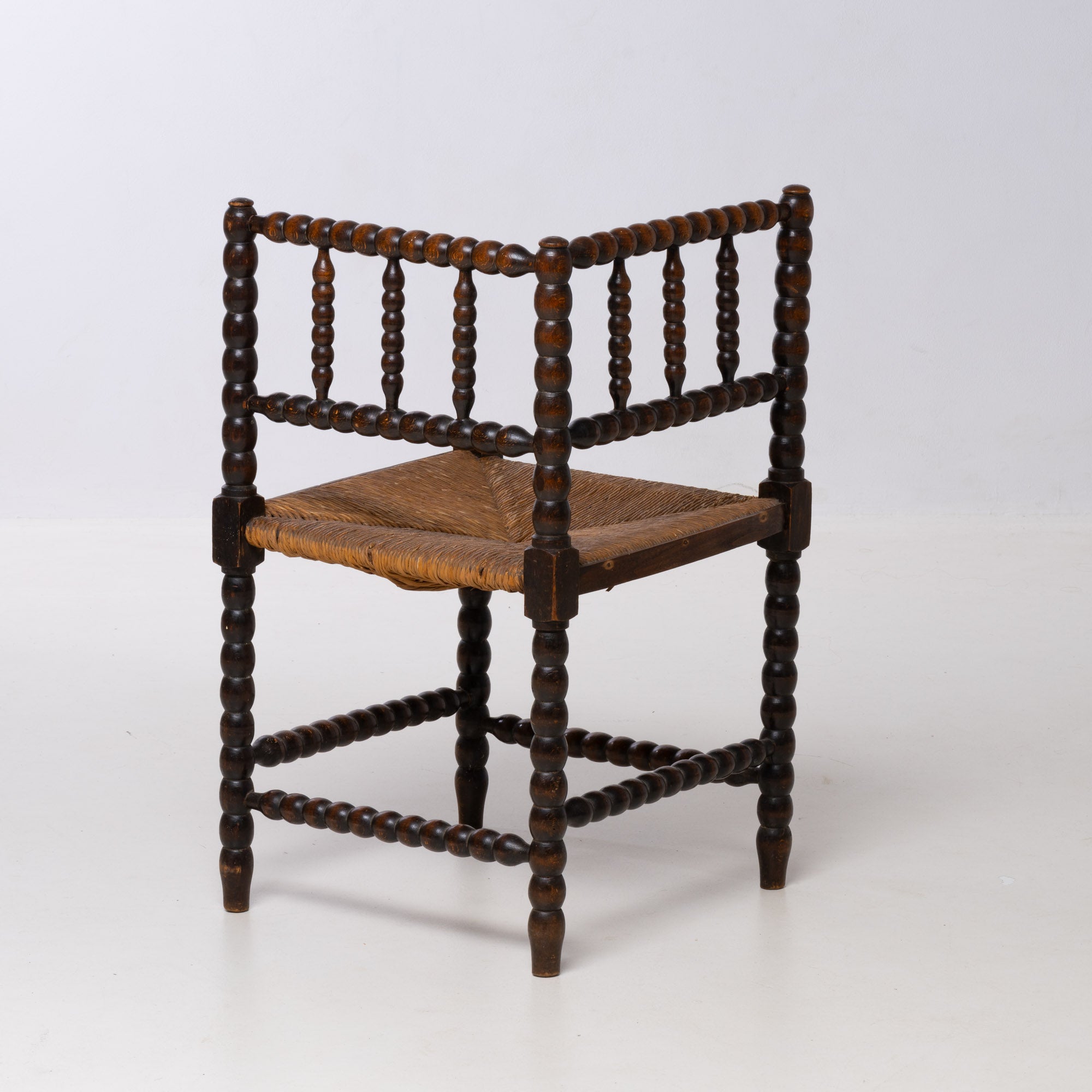 BRUTALIST OAK AND WICKER CORNER CHAIR, 1970S, DUTCH DESIGN