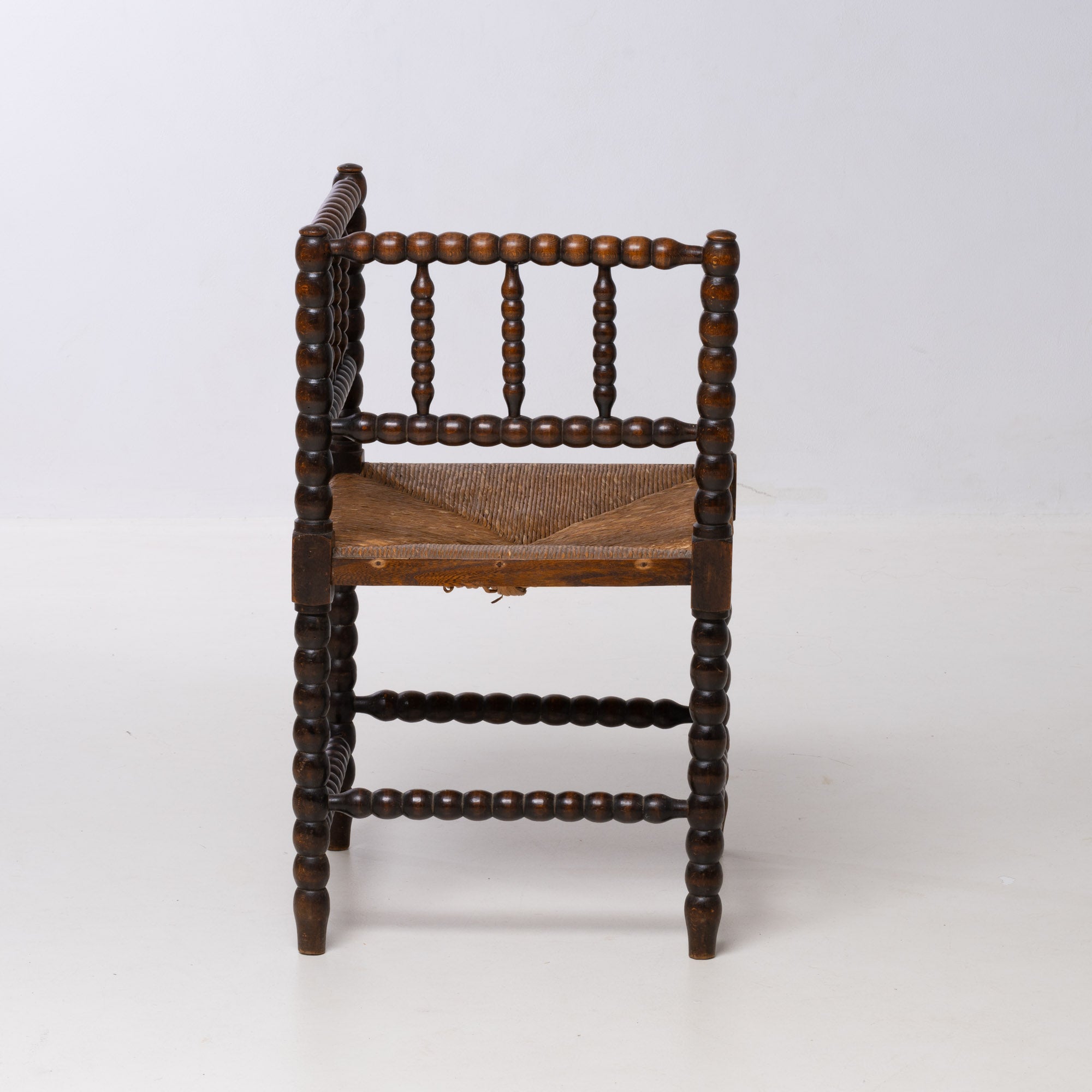 BRUTALIST OAK AND WICKER CORNER CHAIR, 1970S, DUTCH DESIGN