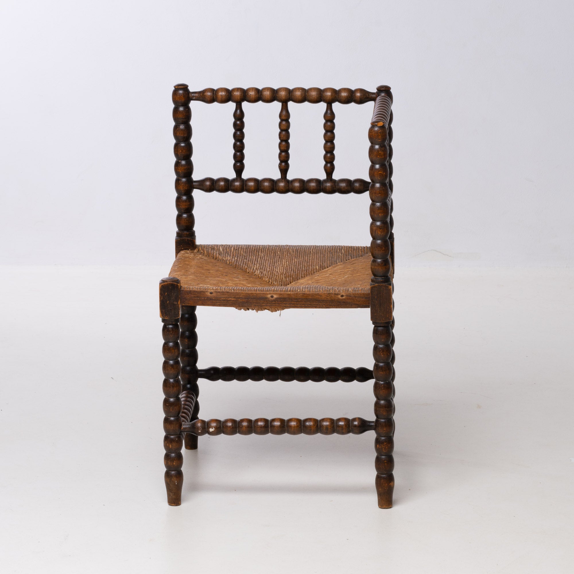 BRUTALIST OAK AND WICKER CORNER CHAIR, 1970S, DUTCH DESIGN